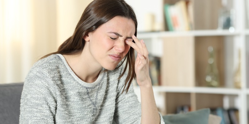 woman dealing with headache pain